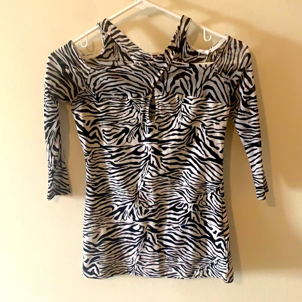 Guess.cut outs.see through arms